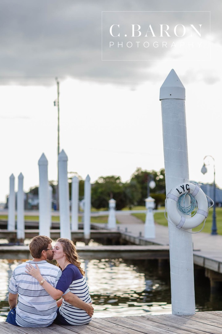 C. Baron Photography; Clear Lake Wedding Photographer; E Session; Engagement session; Houston wedding Photographer; Lakewood Yacht Club; Marina; Masts; Nautical; Nautical Engagement session at the Lakewood Yacht Club in Seabrook Texas; On the water; Sailboat; Seabrook; Texas; Trimaran; Nautical Engagement session at the Lakewood Yacht Club in Seabro; sandals; summer; sunset;